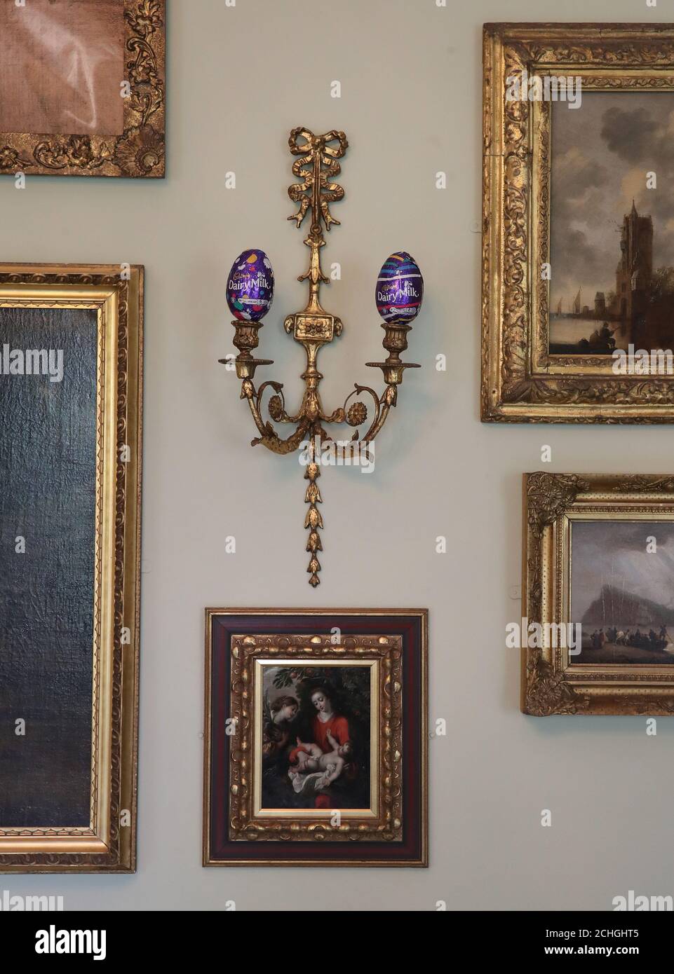 EMBARGOED TO 0001 FRIDAY MAY 22 Easter eggs sit on a candle stick holder in the Drawing Room in the National Trust for Scotland's Georgian House in Edinburgh, as the Trust are trying to find homes for more than 15,000 chocolate eggs that are left over from Easter egg hunts that were cancelled at their properties around the UK due to the coronavirus lockdown. Stock Photo