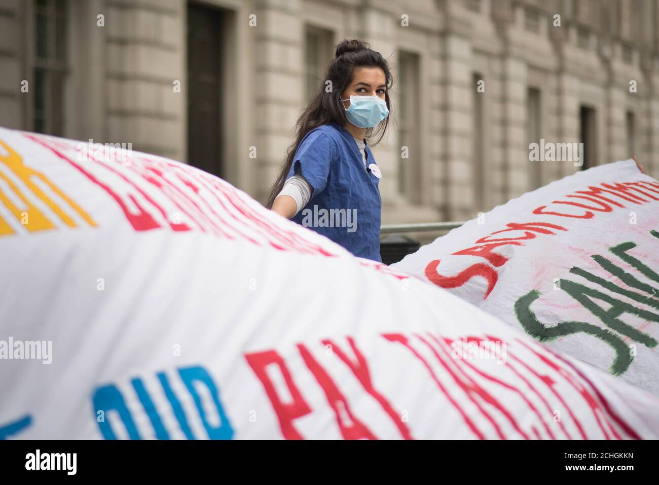 Nurse Ameera Sheikh protests outside Downing Street, London, demanding a pay rise, real protection against COVID-19 and and the release of Public Health England's review into BAME NHS staff's deaths. PA Photo. Picture date: Wednesday June 3, 2020. See PA story HEALTH Coronavirus. Photo credit should read: Stefan Rousseau/PA Wire Stock Photo