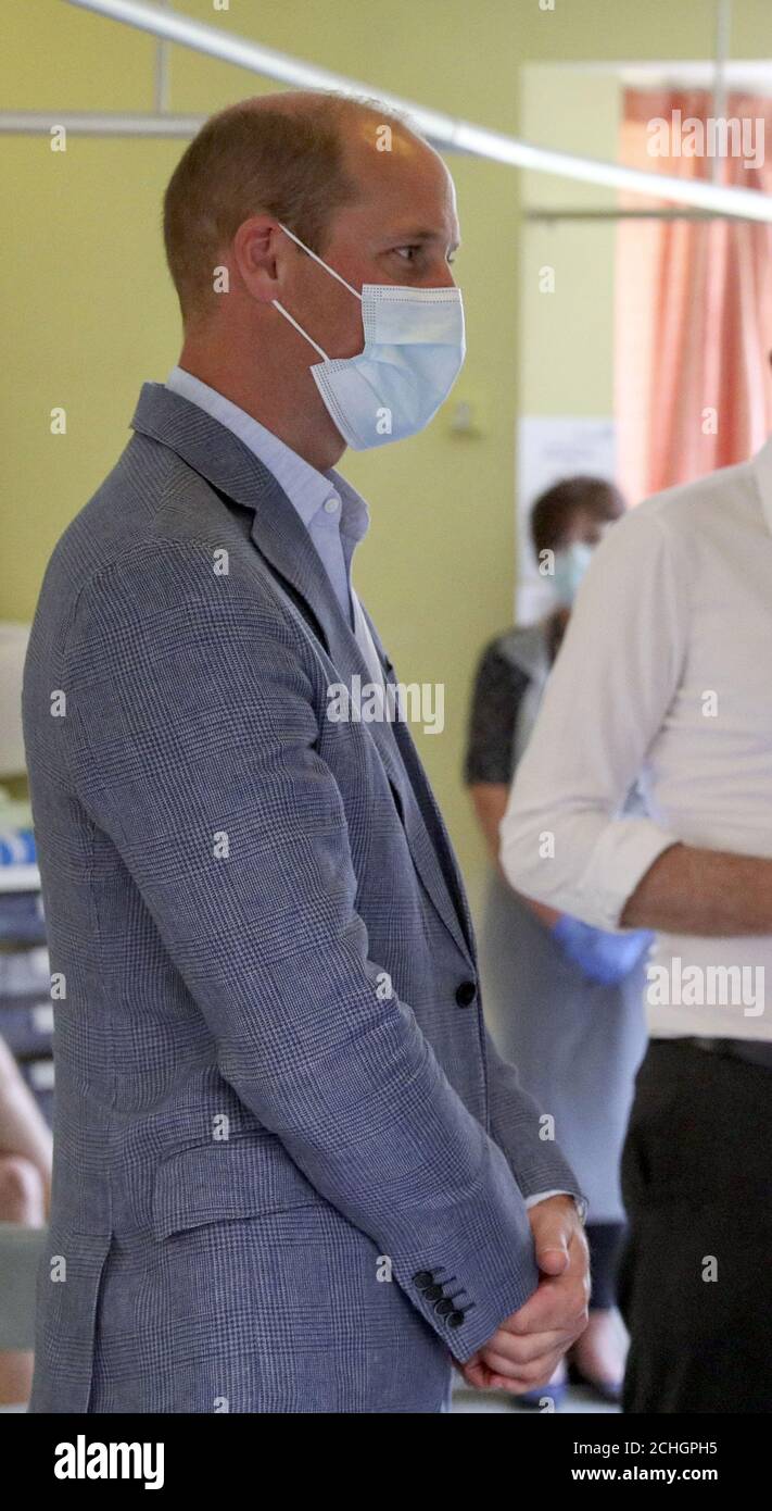 The Duke of Cambridge talks to a patient (unseen) participating in the Covid-19 vaccine trial at the Oxford Vaccine Group's facility at the Churchill Hospital in Oxford during a visit to learn more about their work to establish a viable vaccine against coronavirus. Stock Photo