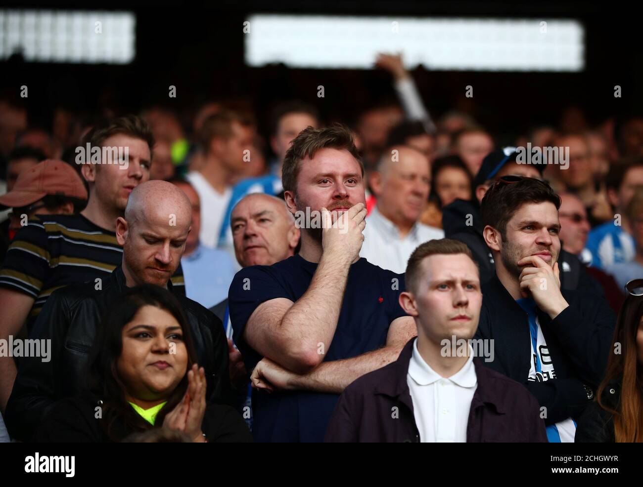 Soccer Football - Premier League - Crystal Palace v Huddersfield Town - Selhurst Park, London, Britain - March 30, 2019  Huddersfield Town fans look on during the match      REUTERS/Hannah McKay  EDITORIAL USE ONLY. No use with unauthorized audio, video, data, fixture lists, club/league logos or 'live' services. Online in-match use limited to 75 images, no video emulation. No use in betting, games or single club/league/player publications.  Please contact your account representative for further details. Stock Photo