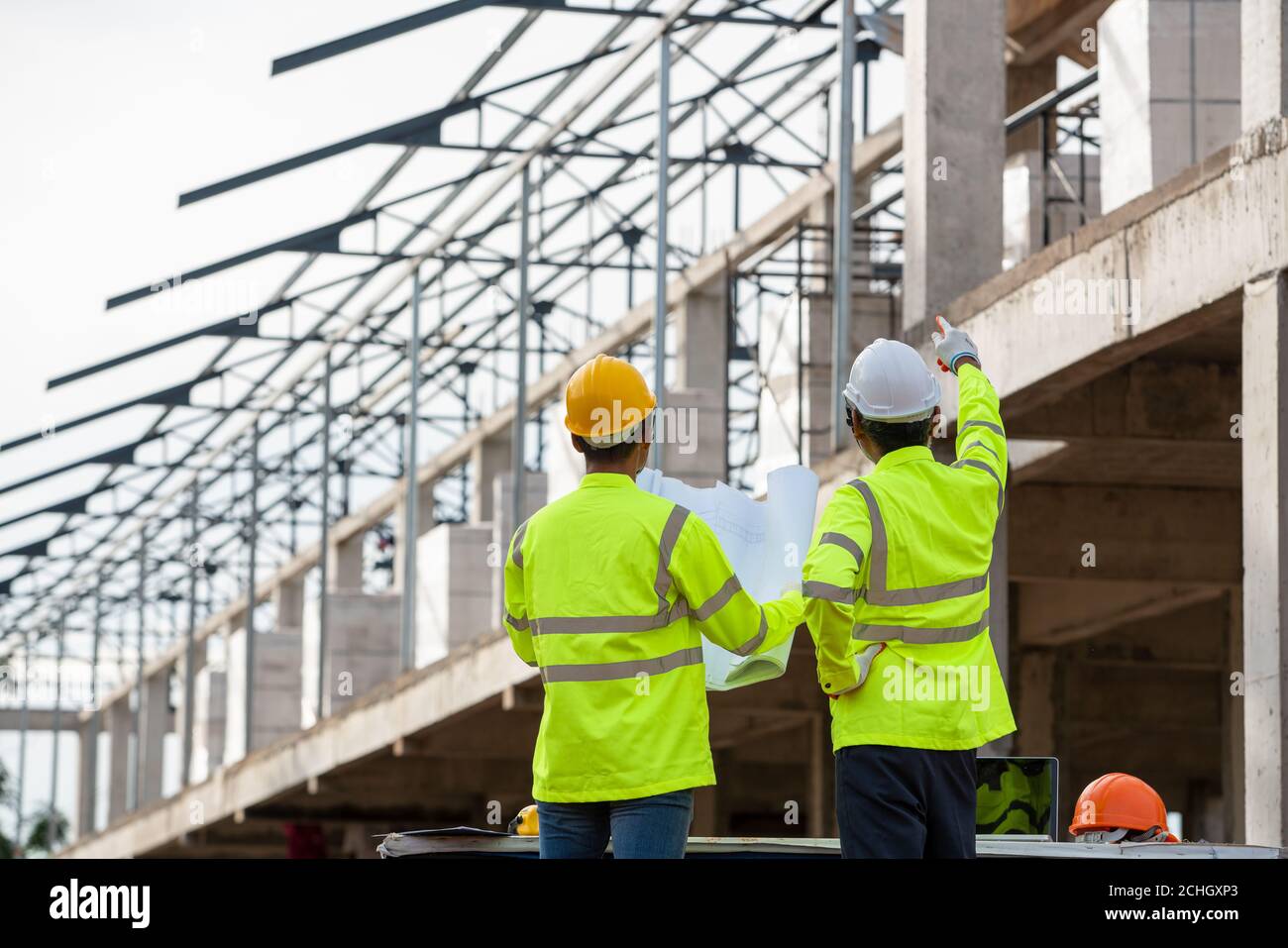 Behind two engineerings in the constructions site Stock Photo