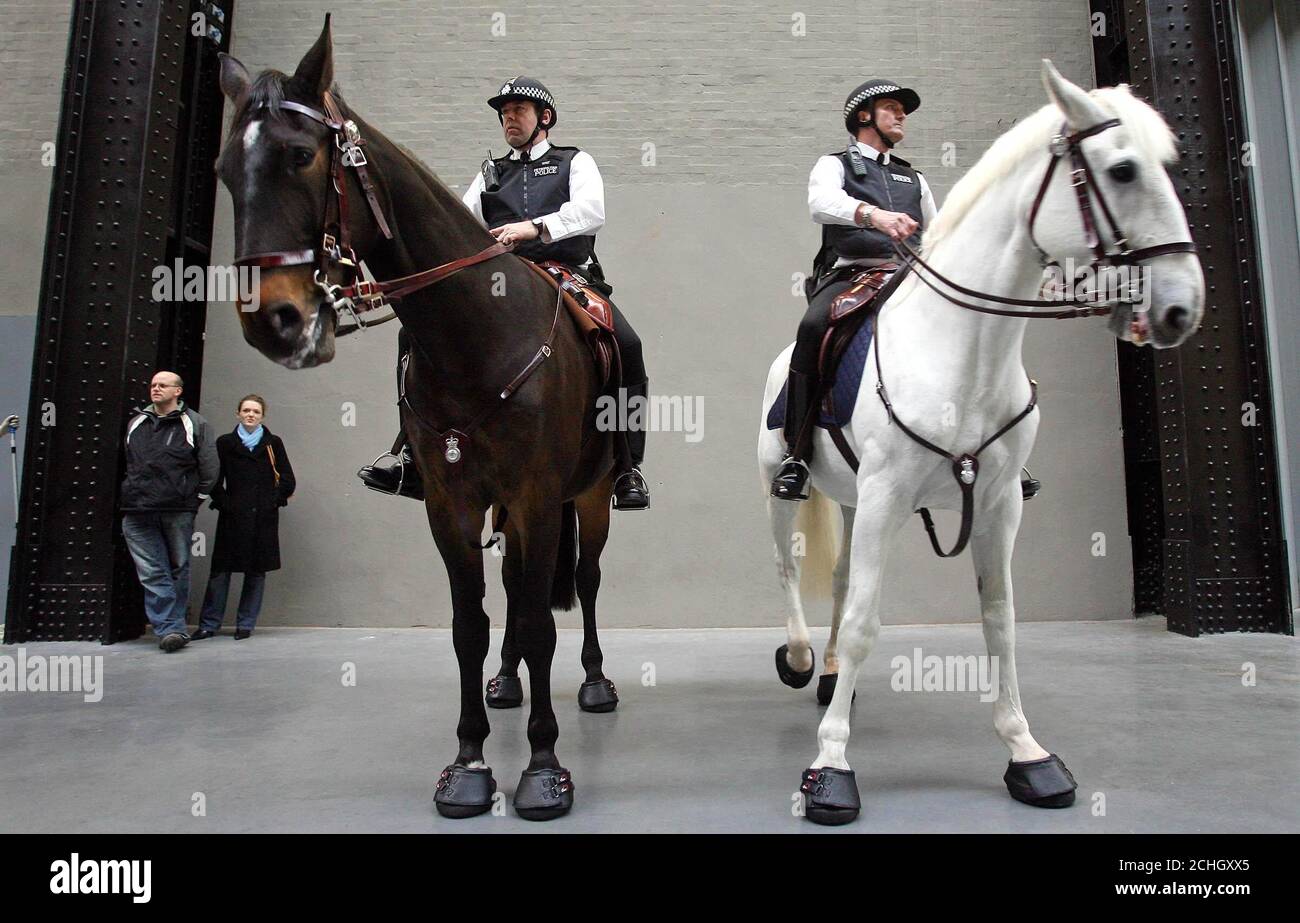 Police horses during an artistic performance at the Tate Modern in London. Stock Photo