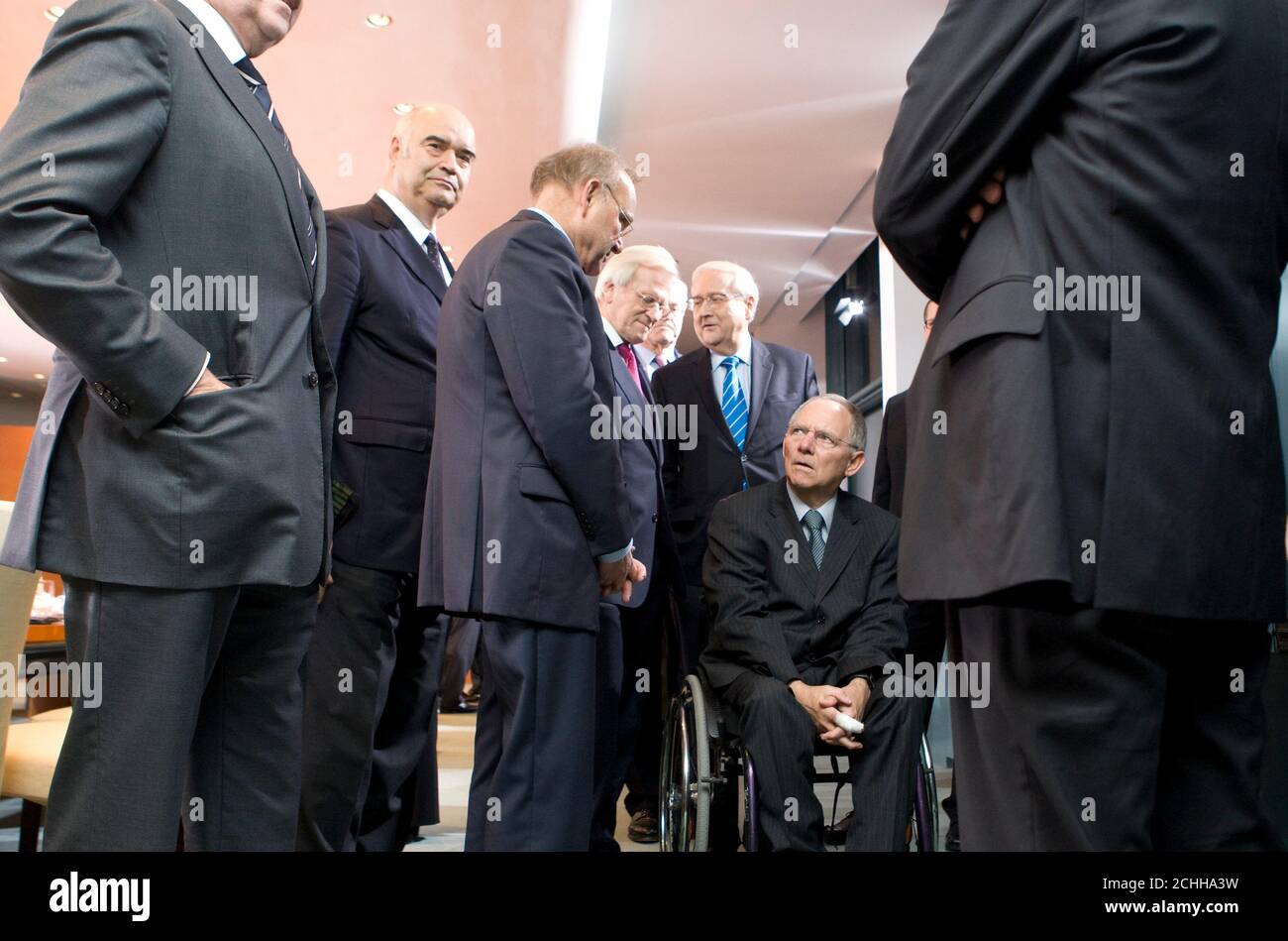 German Wolfgang Schaeuble (2nd L) arrives for a meeting with leaders of the labour unions and the banking and industry sector on the economic situation at the chancellery in Berlin, December 2, 2009.   REUTERS/Thomas Peter (GERMANY - Tags: POLITICS BUSINESS IMAGES OF THE DAY EMPLOYMENT) Stock Photo