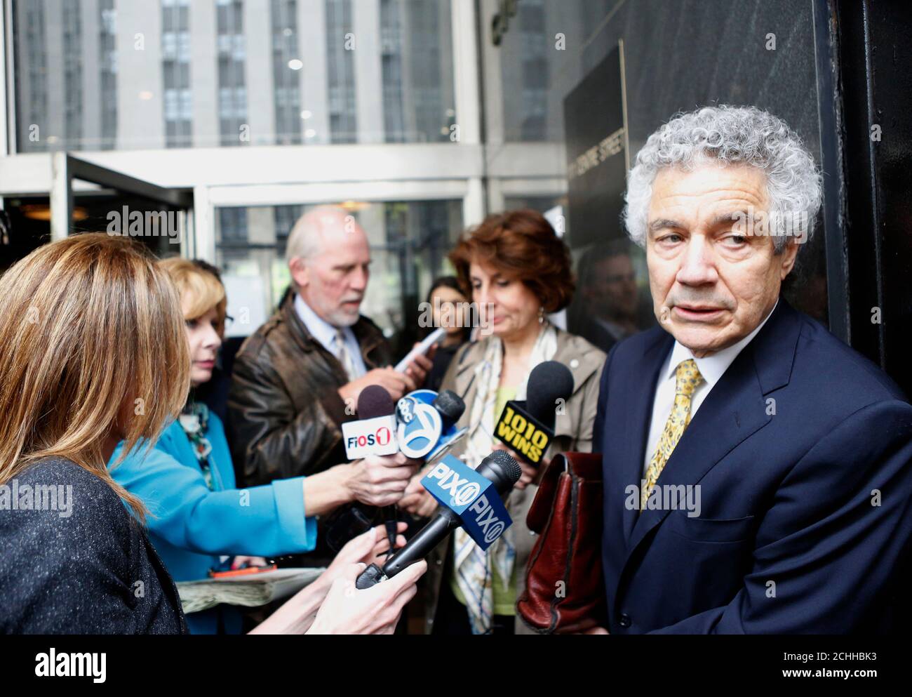 Harvey Fishbein (R), an attorney for Pedro Hernandez, speaks to the press following a hearing outside the state Supreme Court in the Manhattan borough of New York, May 15, 2013. Hernandez who confessed to the 1979 killing of Etan Patz should stand trial for murder and kidnapping in the 6-year-old boy's disappearance, a judge ruled on Wednesday. An attorney for Hernandez, 51, of Maple Shade, New Jersey, had asked the judge to throw out the indictment, arguing that the confession alone was not legally sufficient to support the charges. REUTERS/Brendan McDermid (UNITED STATES - Tags: CRIME LAW) Stock Photo