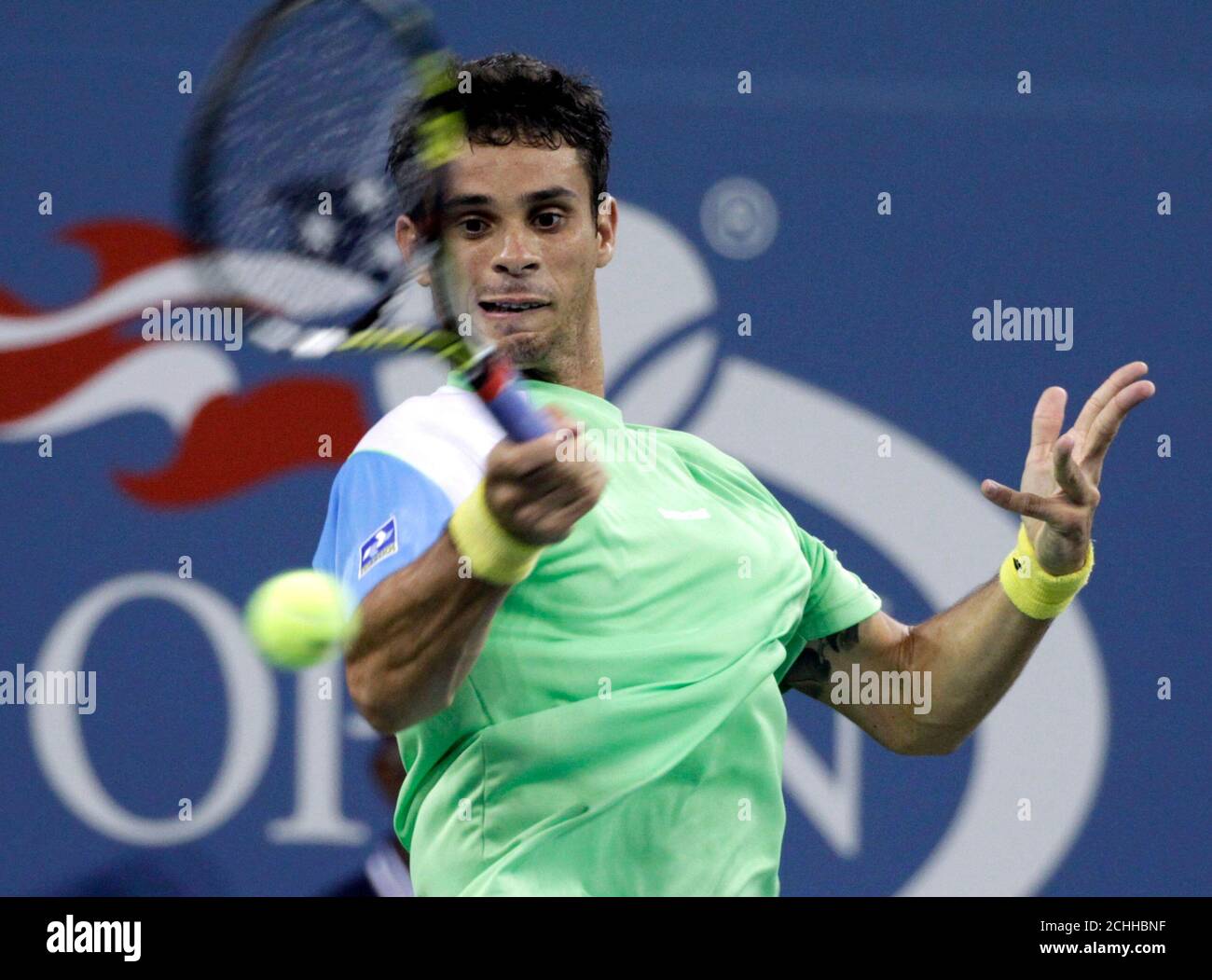 Rogerio Dutra Silva of Brazil returns a forehand to Rafael Nadal of Spain at the U.S. Open tennis championships in New York, August 29, 2013. REUTERS/Shannon Stapleton (UNITED STATES - Tags: SPORT TENNIS) Stock Photo