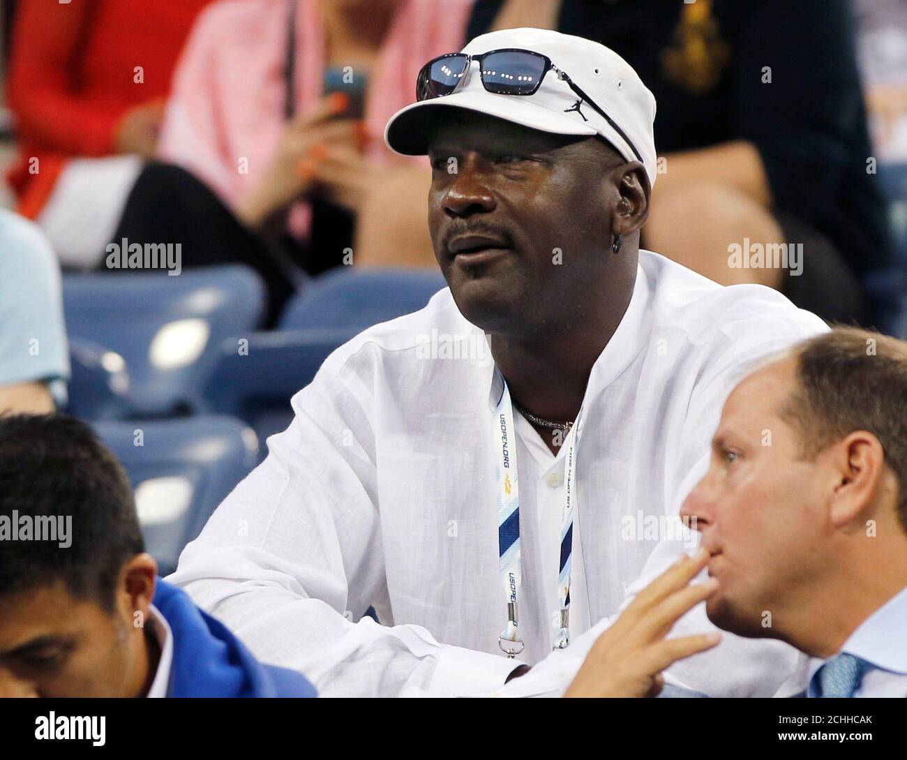 Former basketball great Michael Jordan watches Roger Federer of Switzerland  play Marinko Matosevic of Australia at the U.S. Open tennis tournament in  New York August 26, 2014. REUTERS/Shannon Stapleton (UNITED STATES -