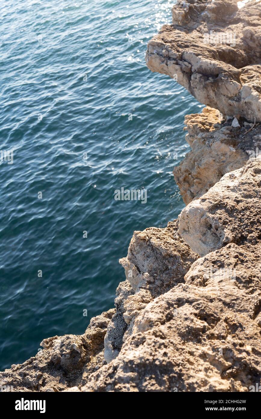Vertical shot of a rocky shore and a sea Stock Photo - Alamy