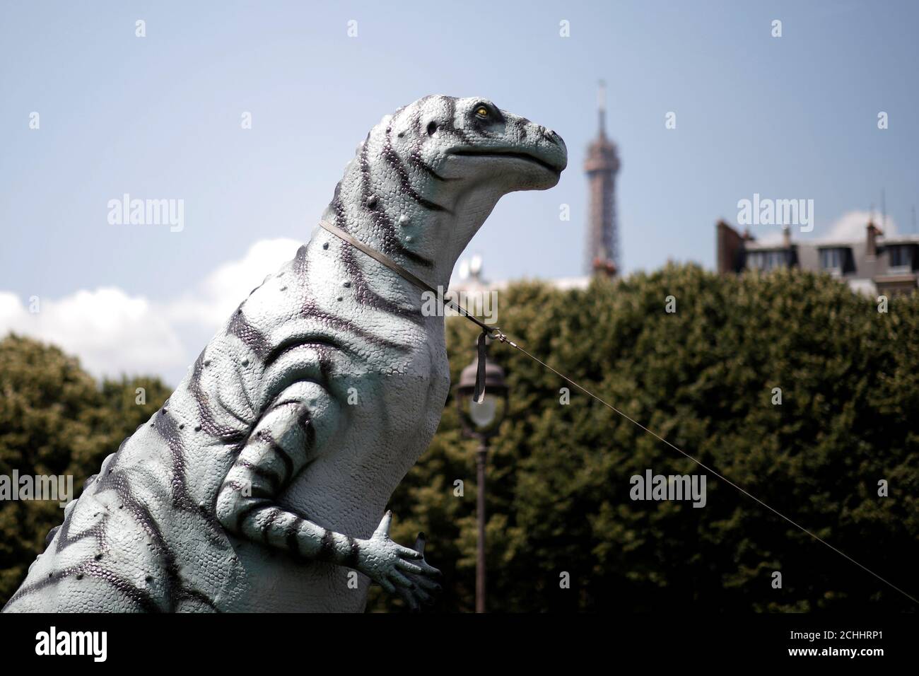 A plastic dinosaur is seen on the Invalides Esplanade during a demonstration held by a group of fairground and circus workers that support the use of animals in their shows, and protest A plastic dinosaur is seen on the Invalides Esplanade during a demonstration held by a group of fairground and circus workers that support the use of animals in their shows, and protest