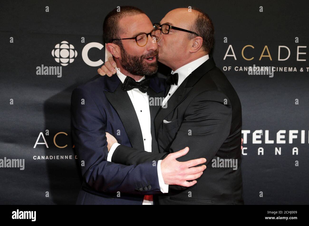 Jacob Tierney, of "Letterkenny," is embraced by Producer Martin Katz, chair  of the Academy of Canadian Cinema and Television, as they arrive on the red  carpet at the 7th annual Canadian Screen
