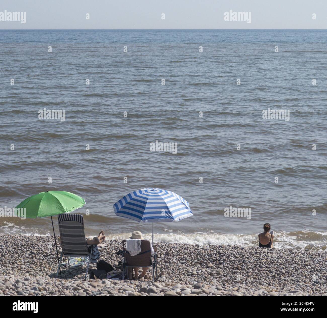 Sidmouth, Devon, 14th Sept 2020 Fabulous weather with temperatures in the 80's on the Devon coast brought lots of visitors to Sidmouth, all happy to keep their distance on the beach within the new 'Rule Of Six' conditions. Credit: Photo Central/Alamy Live News Stock Photo