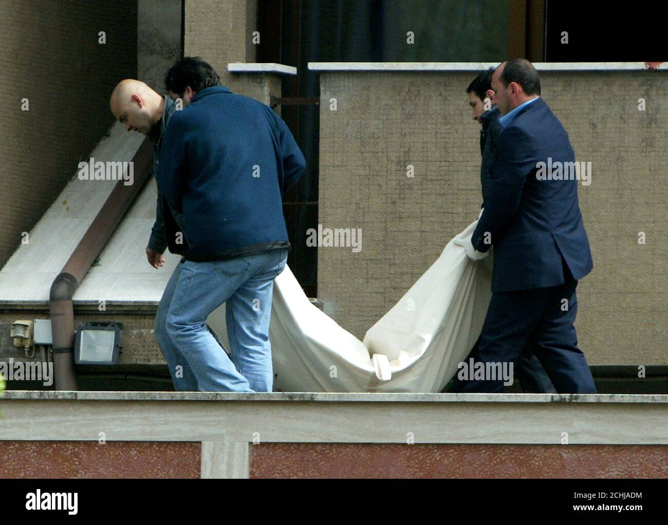 Medical examiners remove the body of a U.S. citizen who died after a fire broke out at around 5 a.m. local time (0300 GMT) in a room on the third floor of Hotel Parco dei Principi in Rome May 1, 2004. A Canadian couple and an American died in a fire at one of Rome's most prestigious hotels early on Saturday, a spokesman for the city's fire service said. Among the guest were several tennis player in town for the Rome Open Tennis Master next week. REUTERS/Max Rossi  MR Stock Photo