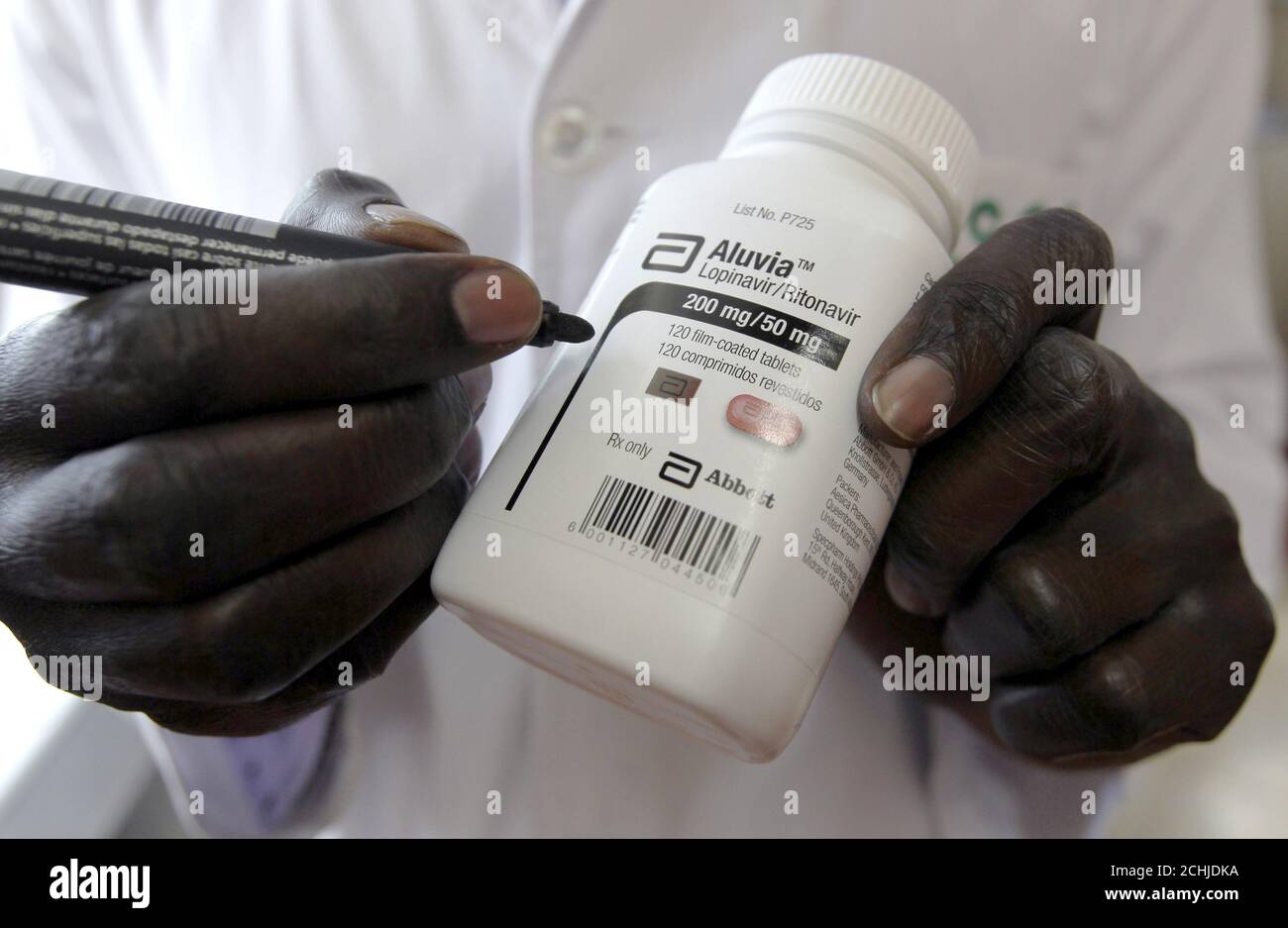 Michael Otieno, a pharmacist,Â dispenses anti-retroviral (ARV) drugs at the Mater Hospital in Kenya's capital Nairobi, September 10, 2015. Most of the 3,000 patients at Mater Hospital's Comprehensive Care Clinic, dedicated to HIV/AIDS treatment, come from nearby shanty towns. In Kenya, HIV prevalence among adults has almost halved since the mid-1990s to 5.3 percent in 2014, according to UNAIDS. Yet HIV/AIDS remains the leading cause of death in Kenya, responsible for nearly three in 10 deaths in the east African country, where 1.6 million Kenyans are infected, government data in 2014 shows. Pi Stock Photo