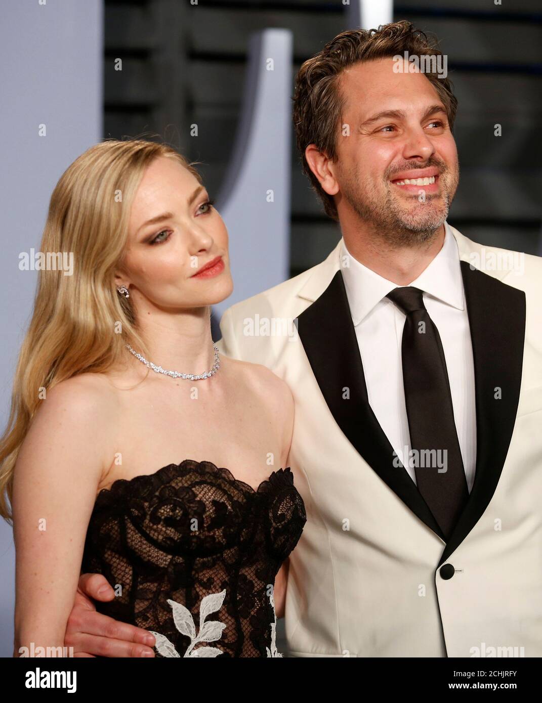 Amanda Seyfried And Husband Thomas Sadoski Attending The Premiere Of Mamma Mia Here We Go Again Held At The Eventim Hammersmith Apollo London Photo Credit Should Read Doug Peters Empics Stock Photo