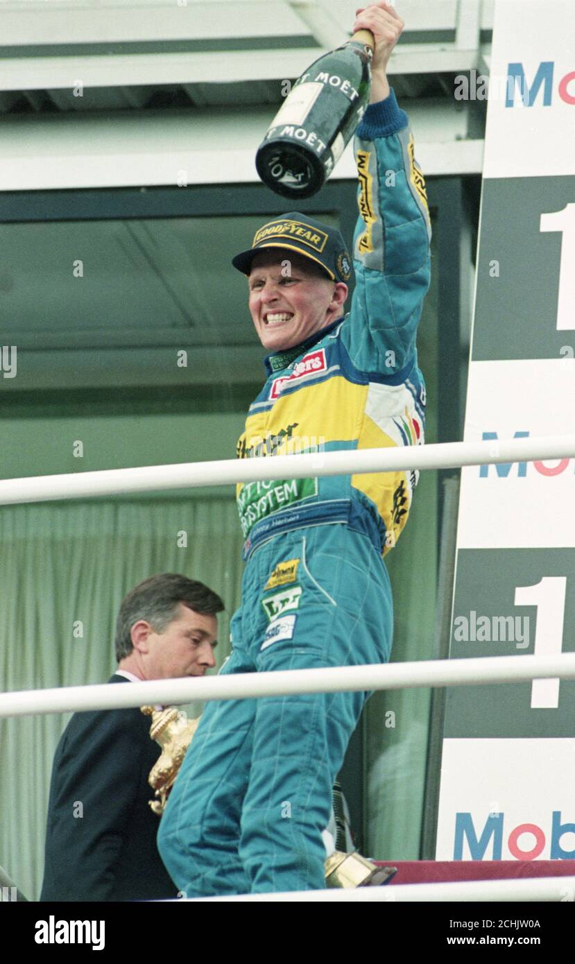 Johnny Herbert celebrates his first Grand Prix win in his 71st race. Stock Photo