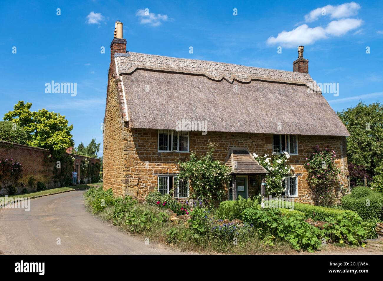 A pretty detached stone built cottage in the picturesque hamlet of Nevill Holt, Leicestershire, England, UK Stock Photo