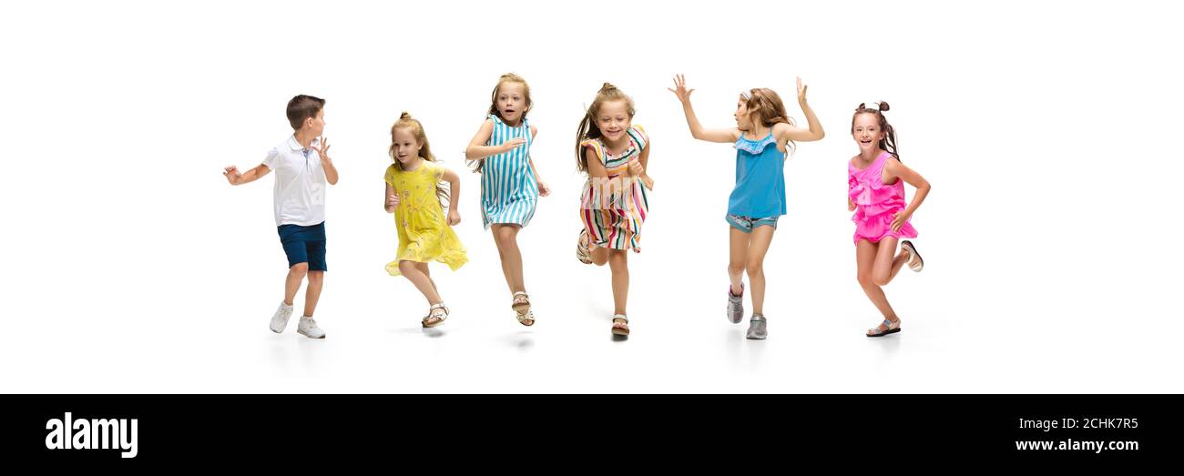 Happy children, little and emotional caucasian kids jumping and running ...