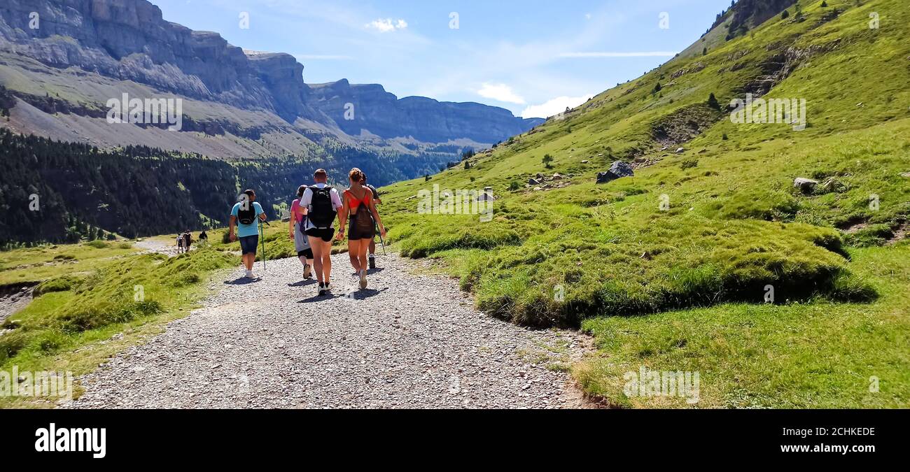 Group of backpackers, people hiking and trekking in Ordesa national park, Pyrenees, Spain Stock Photo