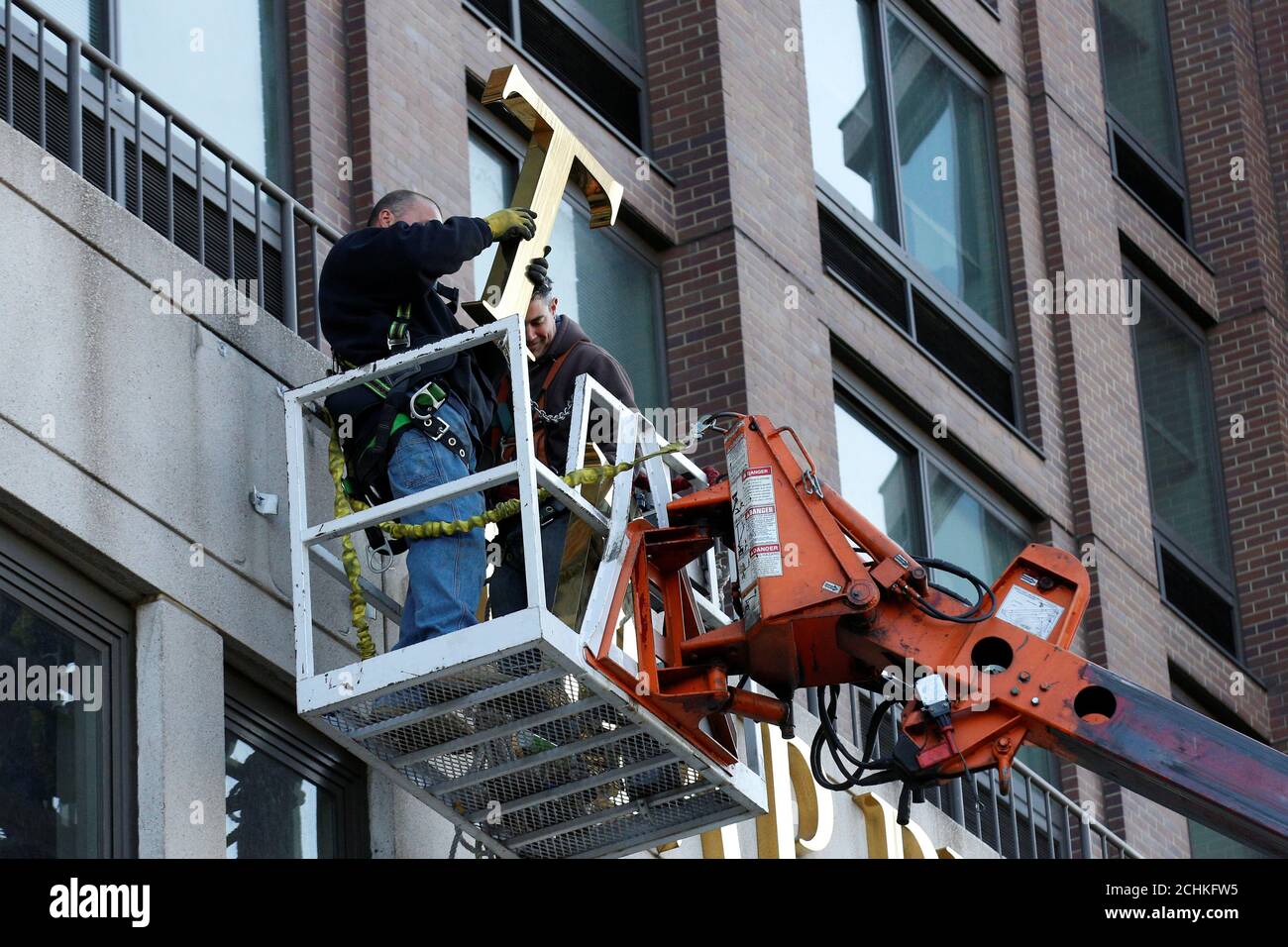 Workers remove signage on the Trump Place apartment buildings on Manhattan's Upper West Side in New York City, U.S., November 16, 2016.  REUTERS/Brendan McDermid Stock Photo