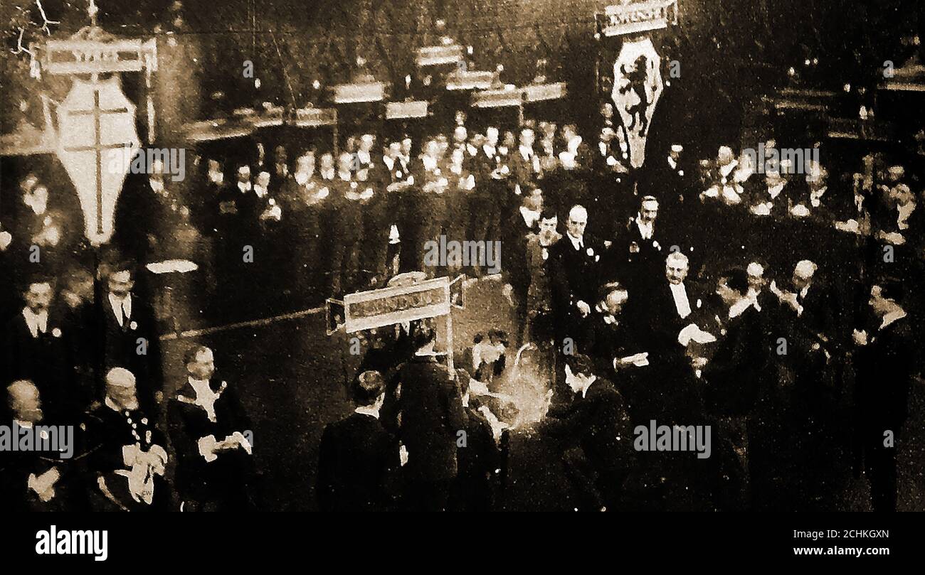 TOC H - The Prince of Wales lighting the Lamp of Maintenance at the Guildhall, London on Dec 15th 1922.The name is an abbreviation for Talbot House, 'Toc' signifies the letter T in the signals spelling alphabet used by the British Army in the First World War. A soldiers' rest and recreation centre named Talbot House was founded in December 1915 at Poperinghe / Poperinge / Pops, Belgium. The name Talbot represents Gilbert Talbot,son of Lavinia Talbot and Edward Talbot, then Bishop of Winchester, who had been killed at Hooge. original building at Poperinghe is now a museum and tourist centre. Stock Photo