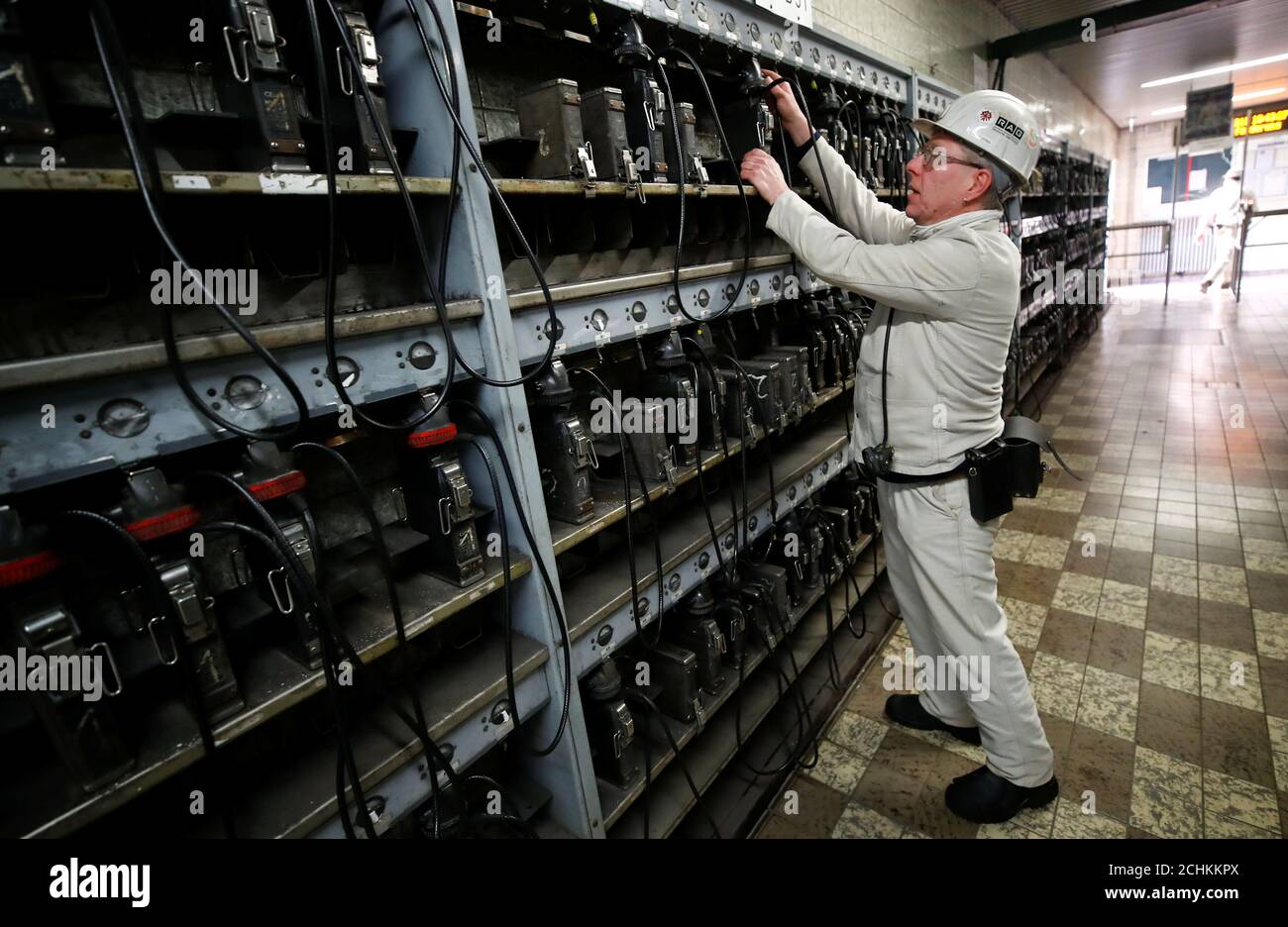 A miner returns his head light onto the charging wall unit of Germany's last active coal mine Prosper-Haniel of the RAG foundation in Bottrop, western Germany, December 11, 2018, that will be officially closed on December 21, 2018. Picture taken December 11, 2018. REUTERS/Wolfgang Rattay Stock Photo