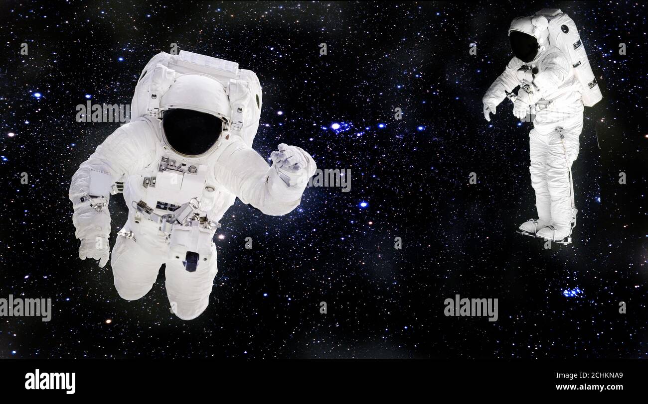Two Astronauts Floating In Space Two Astronauts Floating In Space