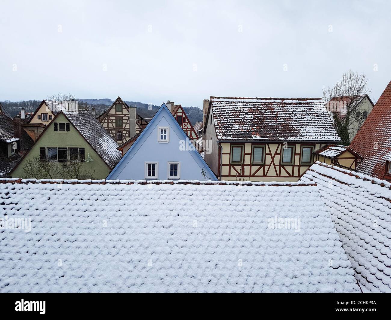 View of roofs that are partially covered with snow Stock Photo - Alamy