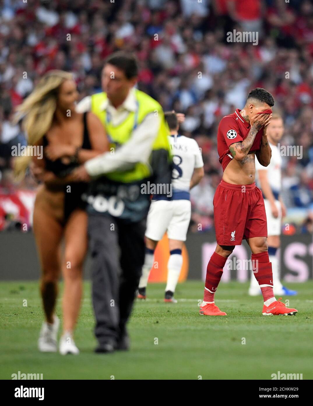 Soccer Football - Champions League Final - Tottenham Hotspur v Liverpool -  Wanda Metropolitano, Madrid, Spain - June 1, 2019 Liverpool's Roberto  Firmino reacts as a pitch invader is apprehended by a