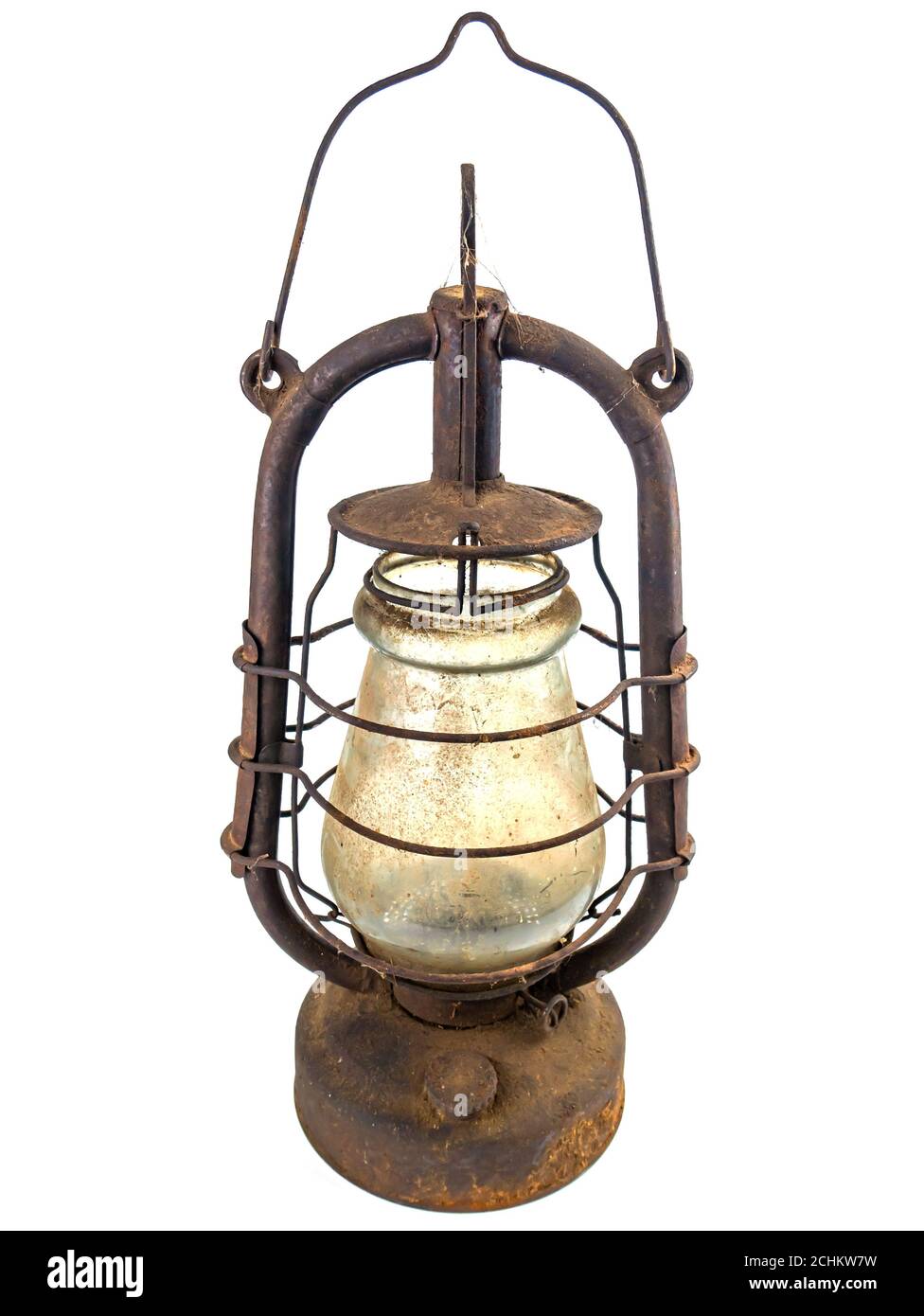 Old rusty kerosene lamp on a white background. Stock Photo