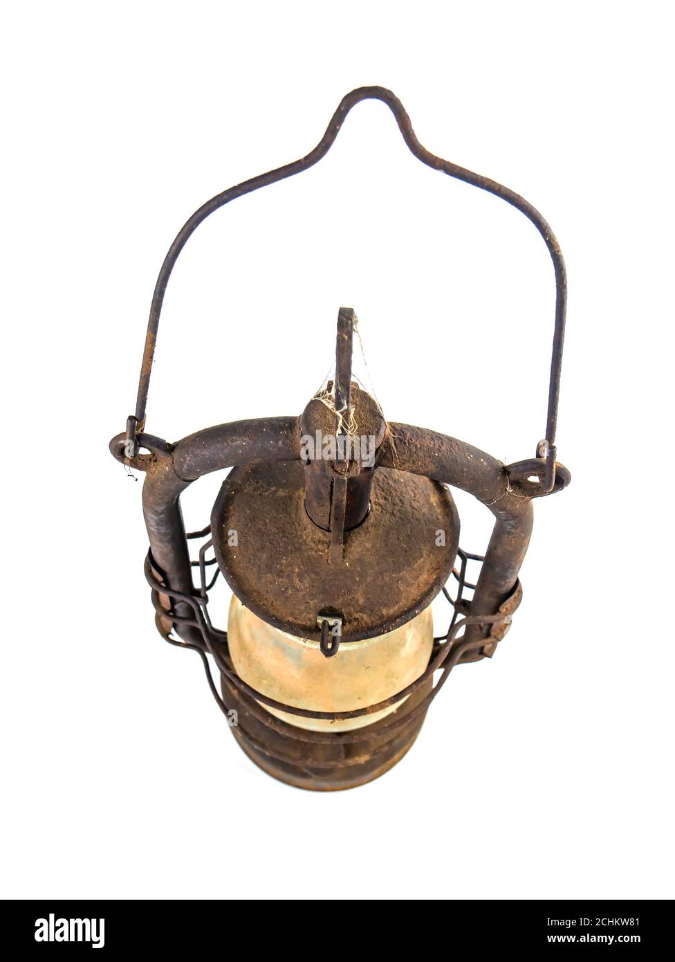 Old rusty kerosene lamp on a white background. Stock Photo