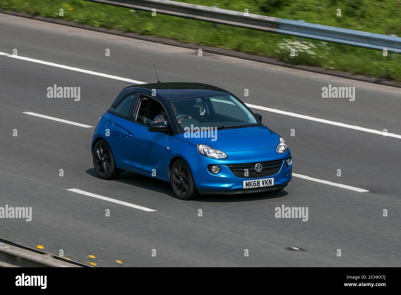 2018 Vauxhall Adam Energised Blue Car Hatchback Petrol driving on the M6 motorway near Preston in Lancashire, UK. Stock Photo
