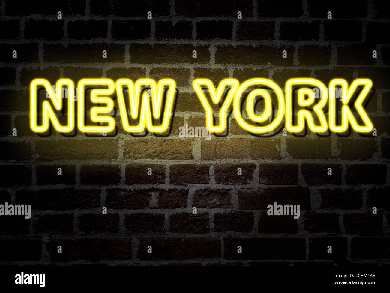 New York City - yellow neon sign on brick wall Stock Photo