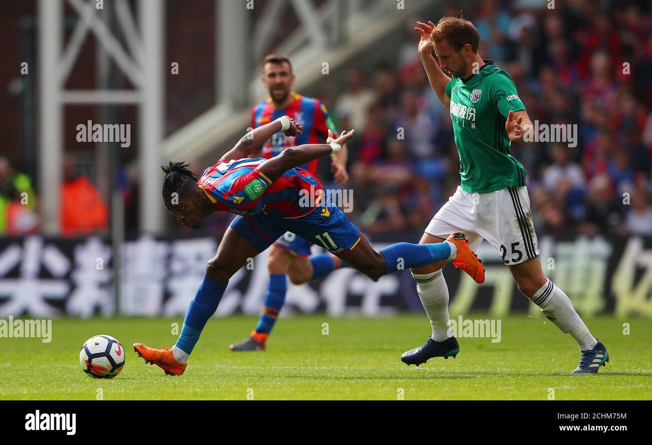 Soccer Football - Premier League - Crystal Palace vs West Bromwich Albion - Selhurst Park, London, Britain - May 13, 2018 Crystal Palace's Wilfried Zaha in action with West Bromwich Albion's Craig Dawson REUTERS/Hannah McKay EDITORIAL USE ONLY. No use with unauthorized audio, video, data, fixture lists, club/league logos or "live" services. Online in-match use limited to 75 images, no video emulation. No use in betting, games or single club/league/player publications. Please contact your account representative for further details. Stock Photo