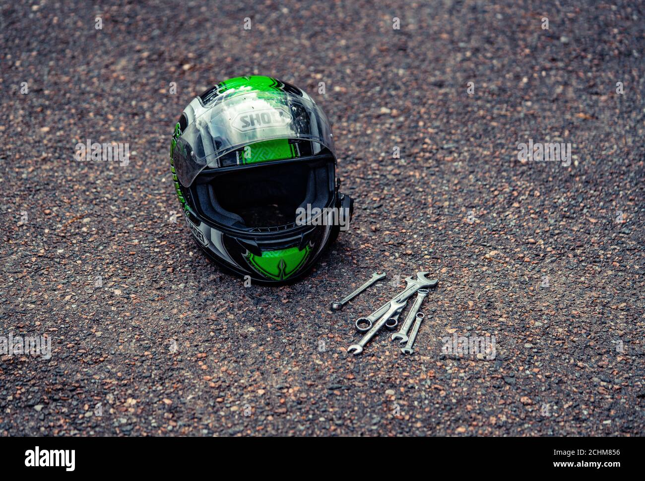 motorcycle helmet at ground and some tools near it Stock Photo Alamy