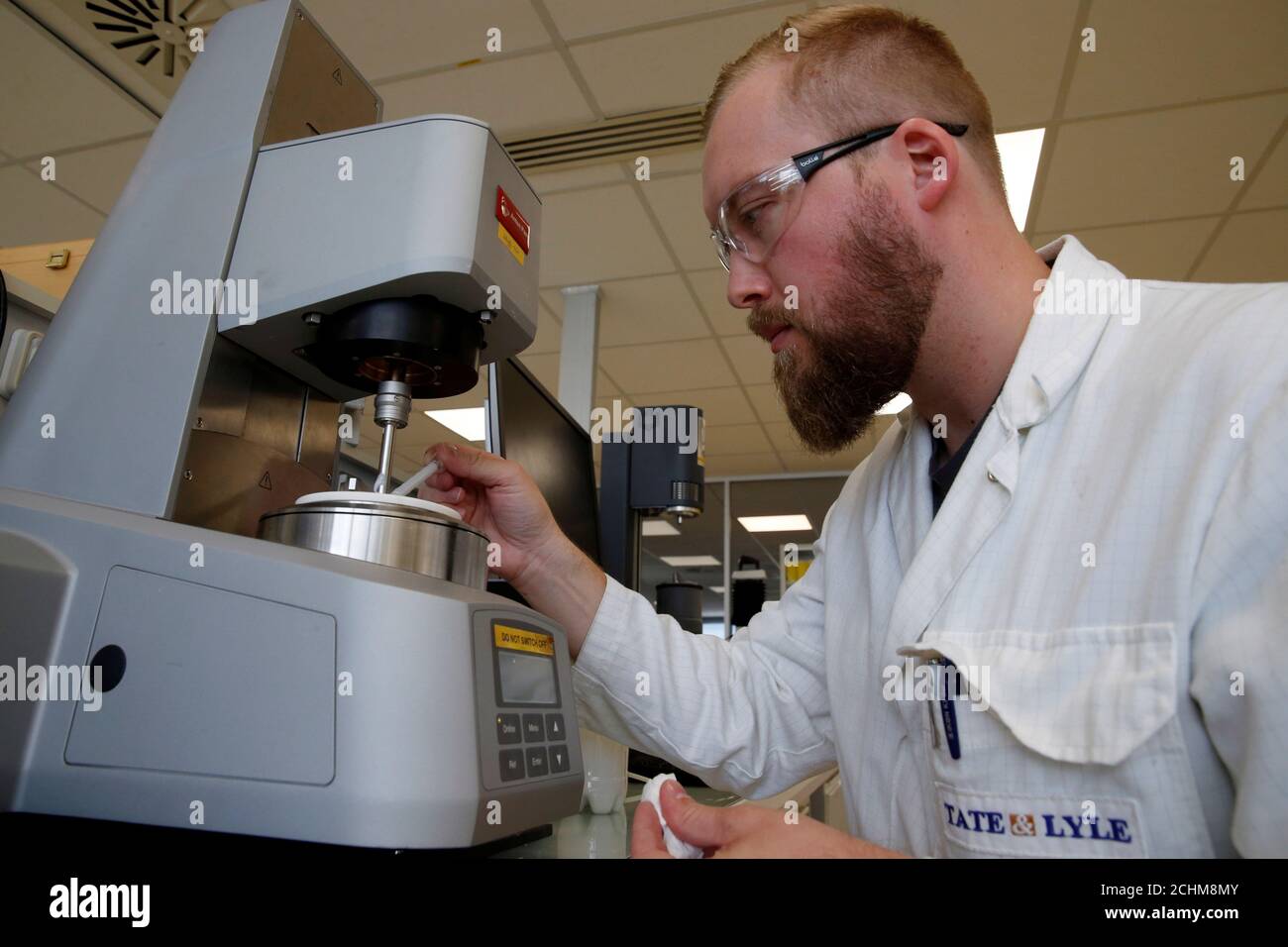 A technician uses a rheometer to measure viscosity of cream at the Tate