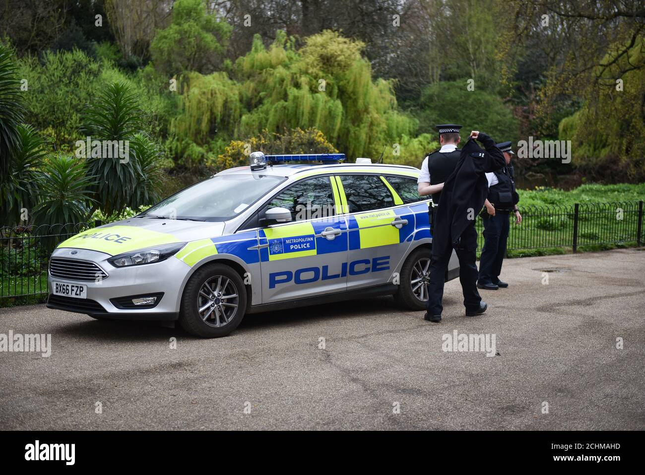 London Metropolitan Police Car in the City of London. Two policemen are sent to a possible crime scene in the park. London, UK April 2017 Stock Photo