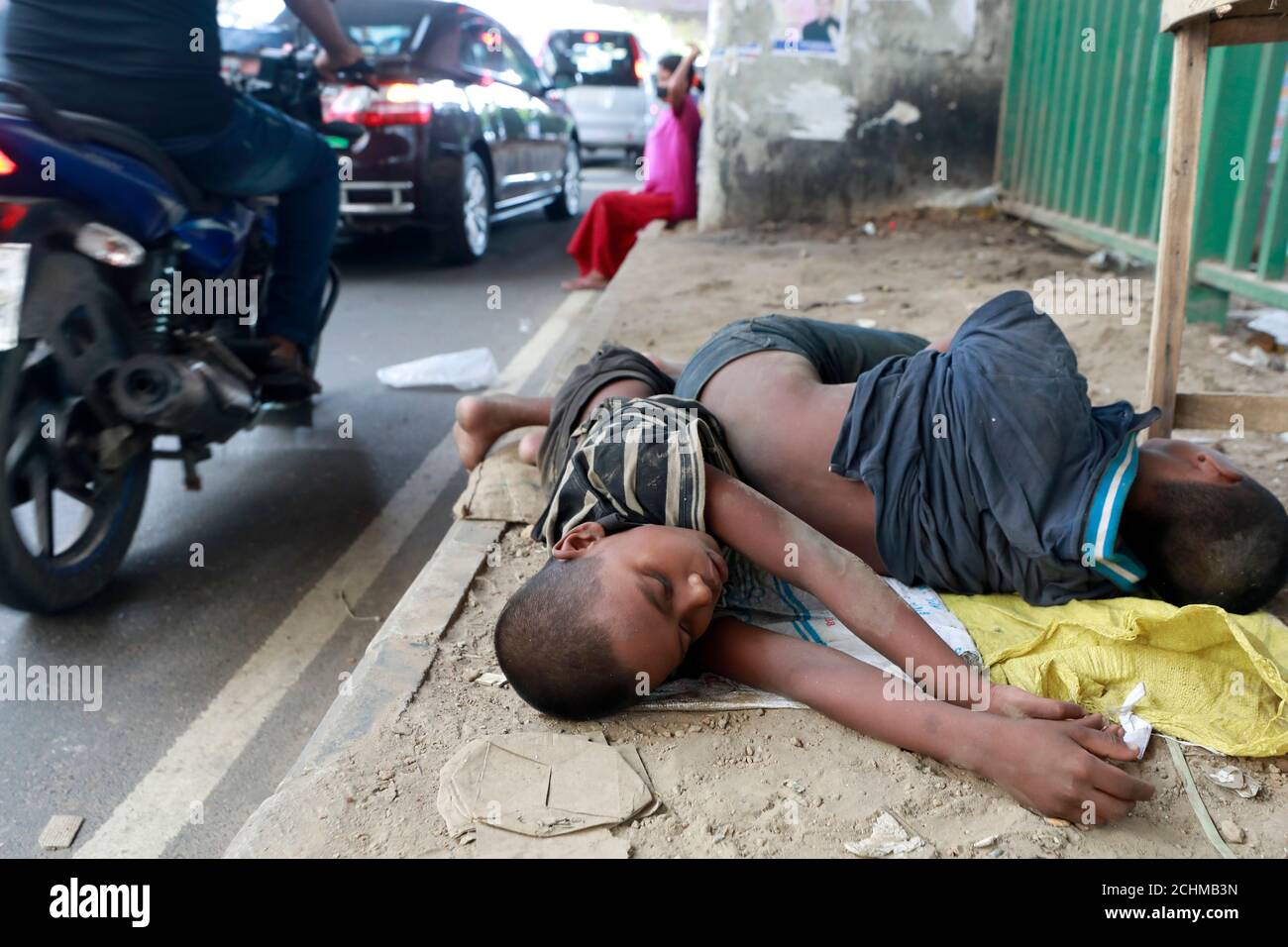 Dhaka, Bangladesh - September 13, 2020: Bangladeshi homeless children sleep on a roadside footpath in Dhaka, Bangladesh on September 13, 2020. Stock Photo
