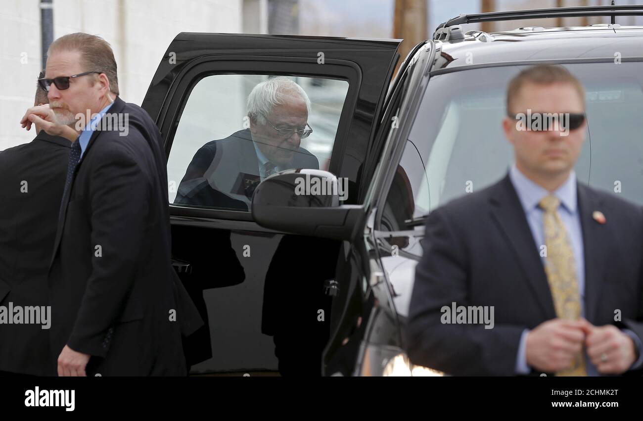 U.S. Secret Service provide security for Democratic presidential candidate Bernie Sanders as he gets into his car at Victory Missionary Baptist Church in Las Vegas, Nevada, United States, February 14, 2016.   REUTERS/Jim Young Stock Photo