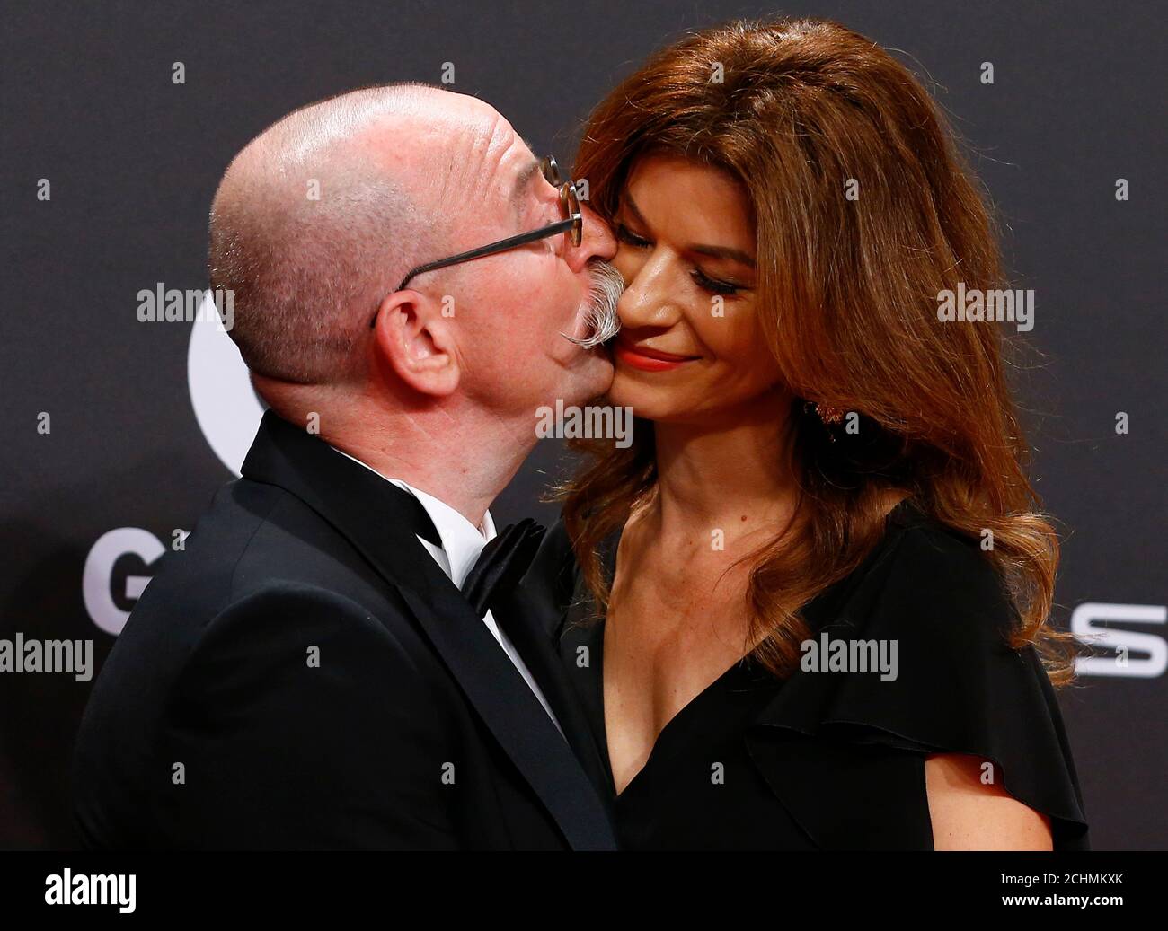 Horst Lichter kisses his wife Nada on the red carpet for the 'Golden Camera'  ('Die Goldene Kamera') awards ceremony of German TV magazine 'Hoer Zu' in  Hamburg, March 4, 2017. REUTERS/Morris Mac