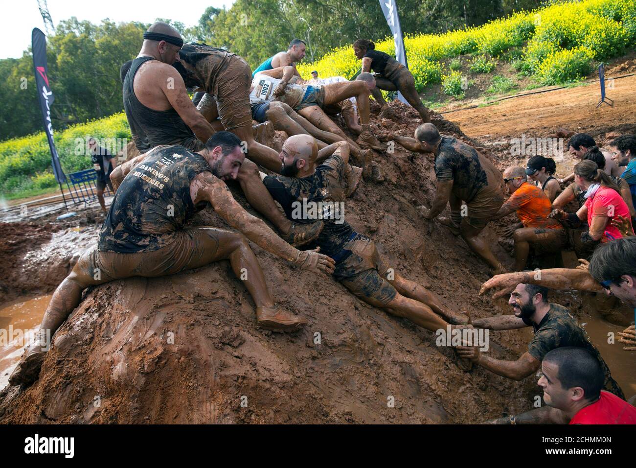 Participants take part in the first Mud Day Israel obstacle course race in Tel Aviv, Israel March 24, 2017.   REUTERS/Baz Ratner Stock Photo