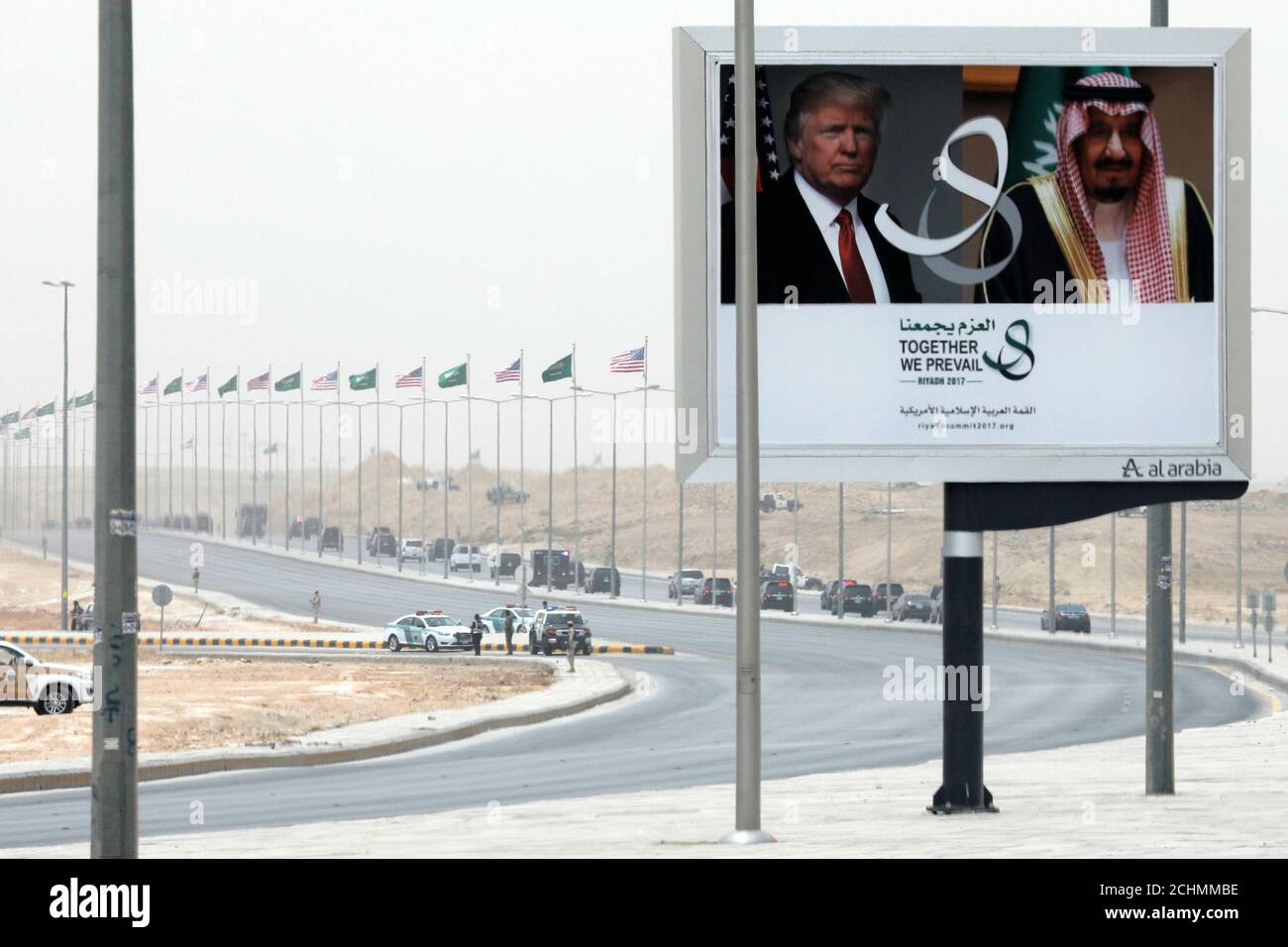 U.S. President Donald Trump's motorcade passes a billboard advertising his visit with Saudi Arabia's King Salman bin Abdulaziz Al Saud upon his arrival in Riyadh, Saudi Arabia May 20, 2017. REUTERS/Jonathan Ernst Stock Photo