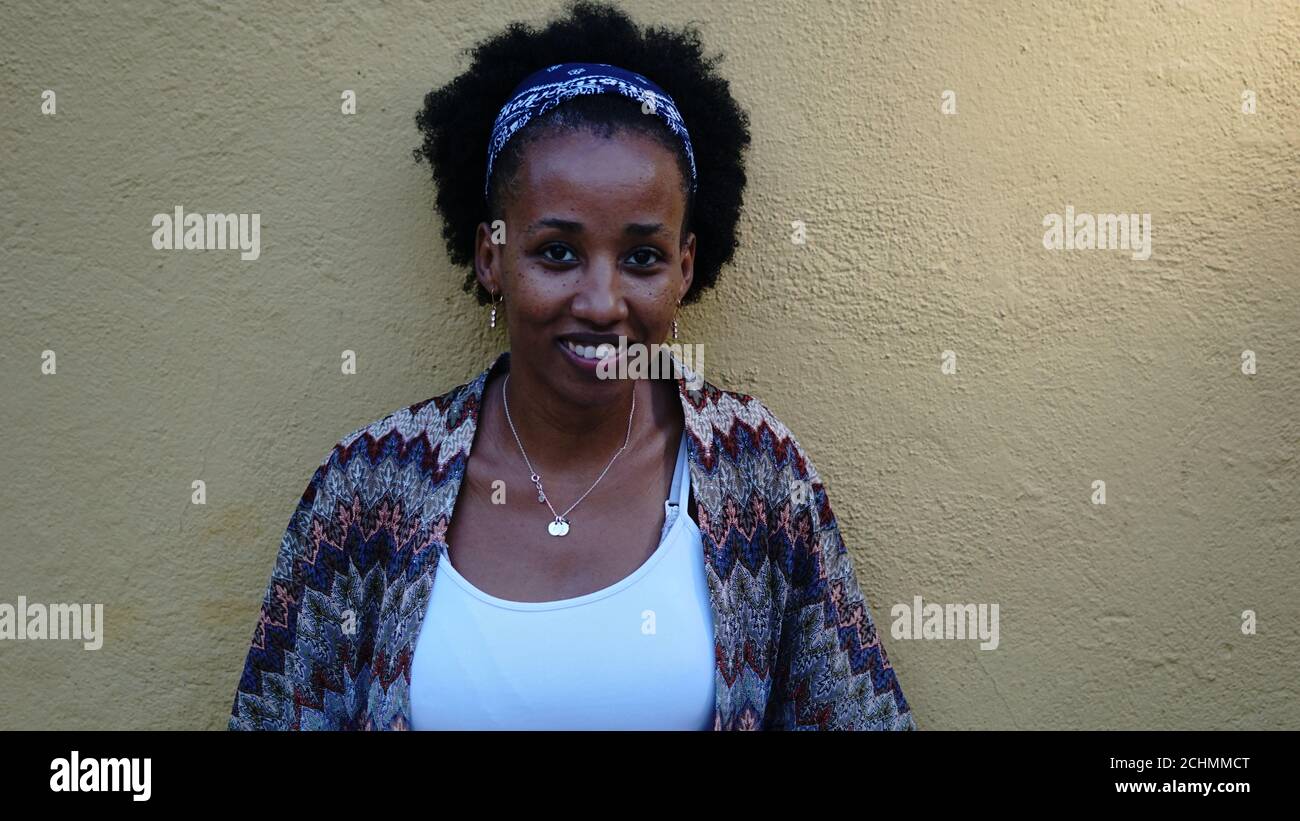 young black woman toothy smiling and looking at camera Stock Photo