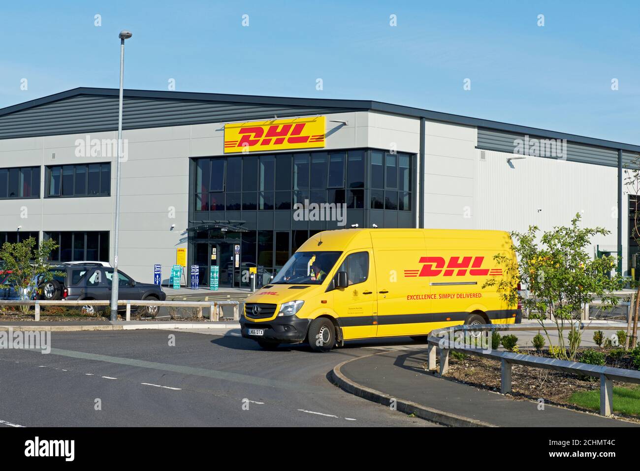 DHL delivery van leaving the DHL hub in Ozone Park, Howden, East Yorkshire, England UK Stock Photo