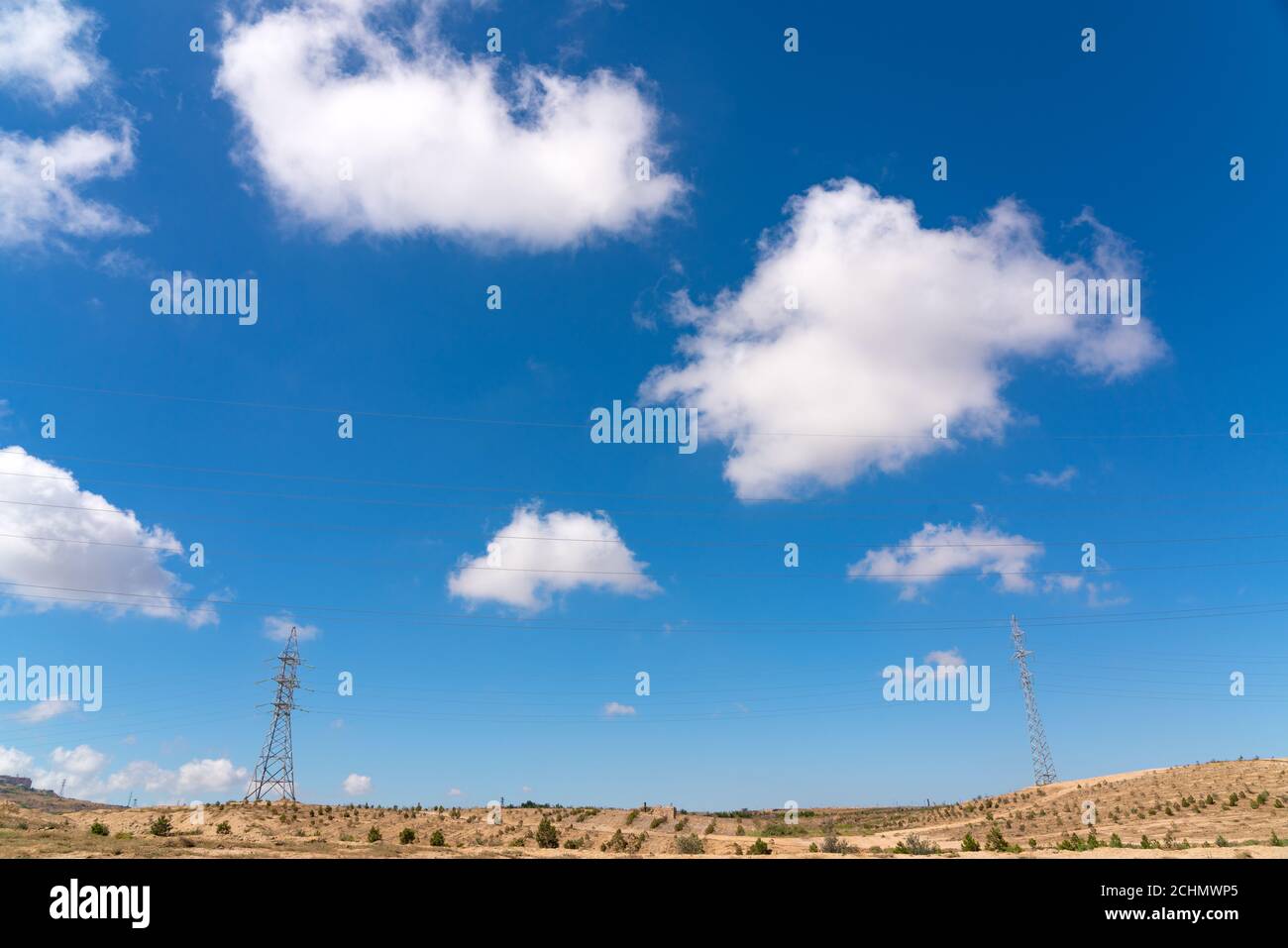 High voltage towers with sky background Stock Photo - Alamy