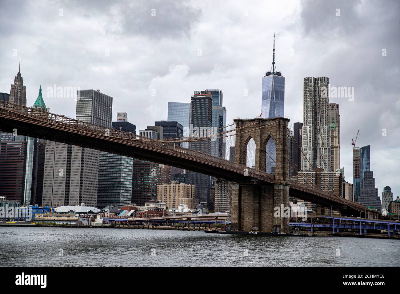 A view of lower Manhattan skyline from the East River in New York City ...
