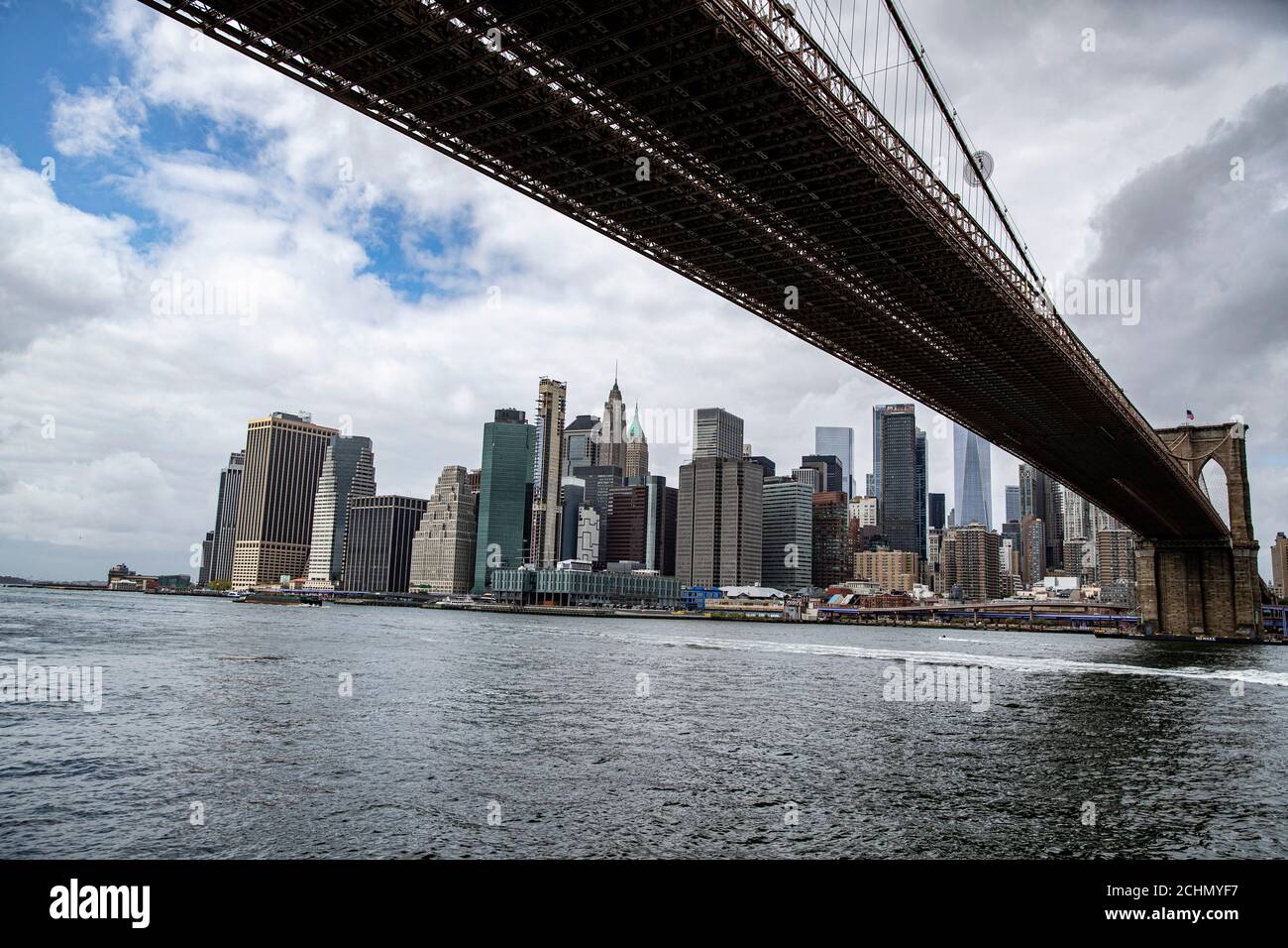 A view of lower Manhattan skyline from the East River in New York City ...