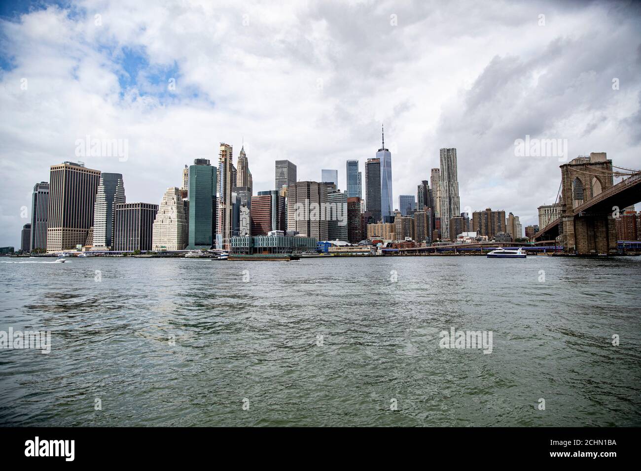 A view of lower Manhattan skyline from the East River in New York City ...
