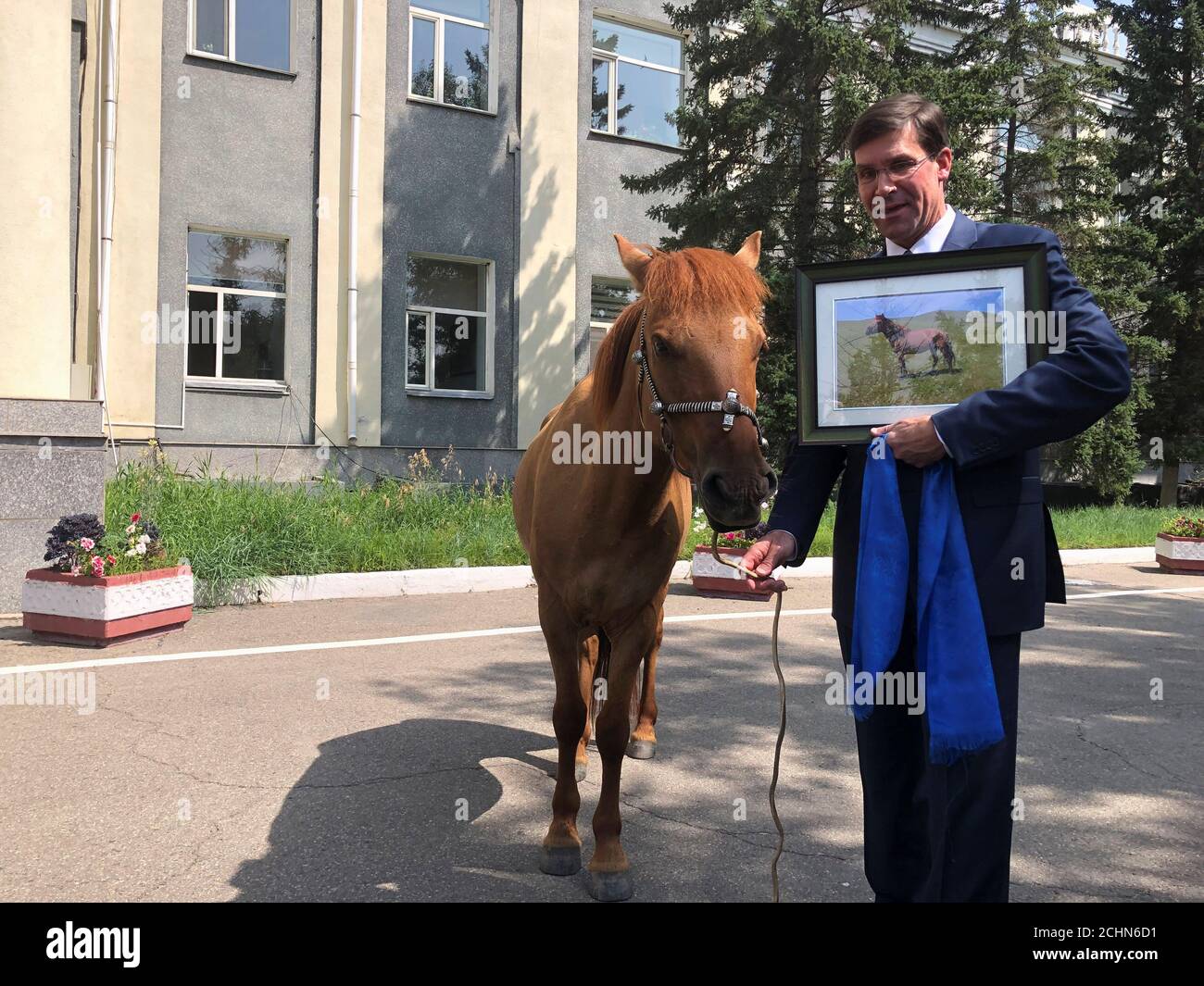 U.S. Secretary of Defense Mark Esper is gifted a horse in Ulan Bator, Mongolia August 8, 2019. REUTERS/Idrees Ali Stock Photo