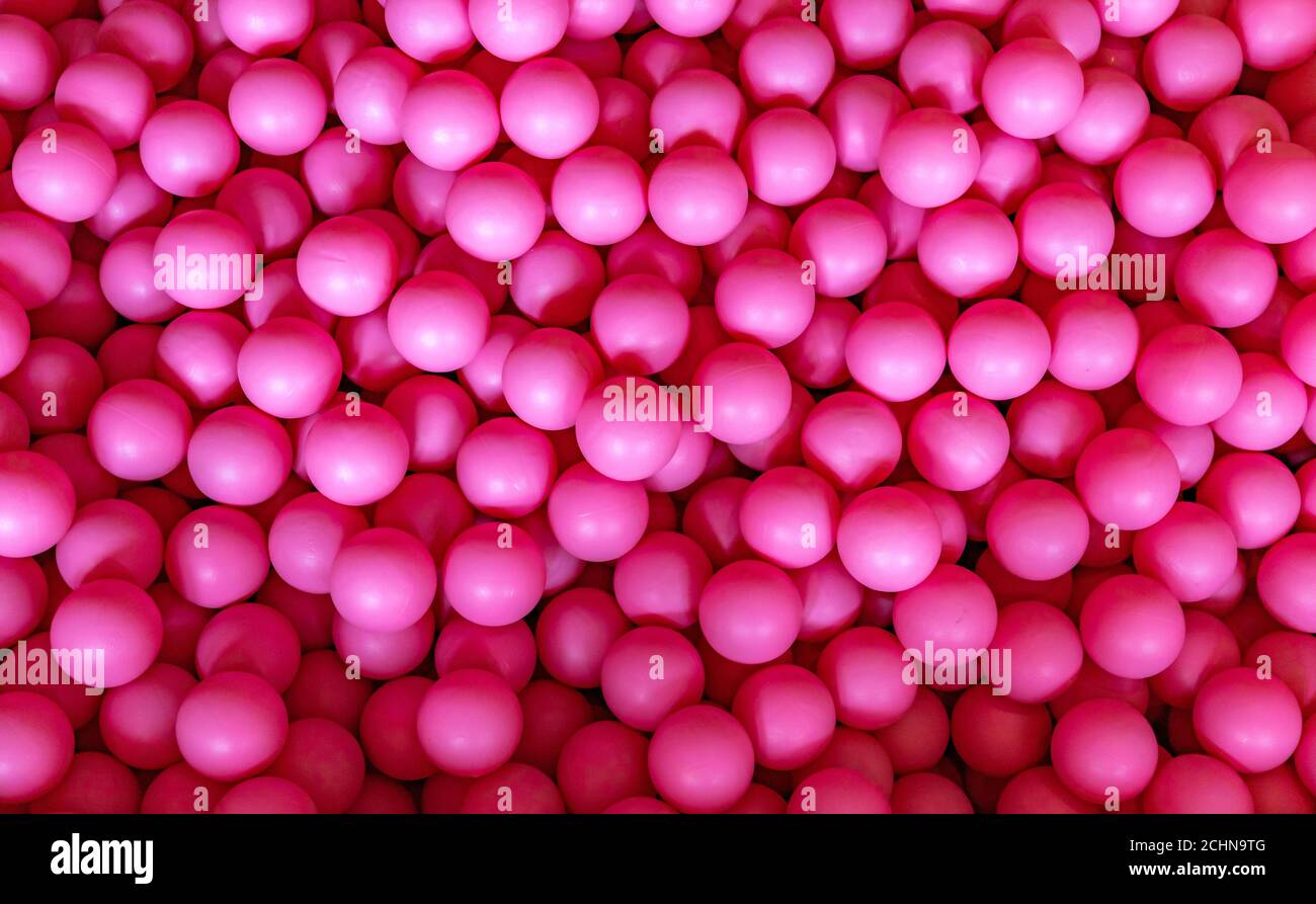 A picture of a ball pit full of small pink balls Stock Photo Alamy