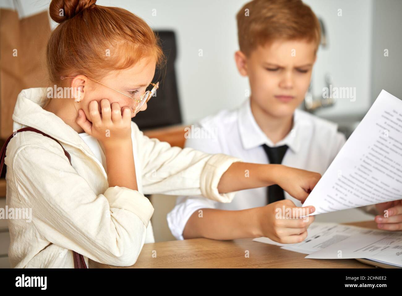 beautiful caucasian couple children work on laptop together, solve family problems, pay bills online, have talk. at home, they behave themselves as ad Stock Photo