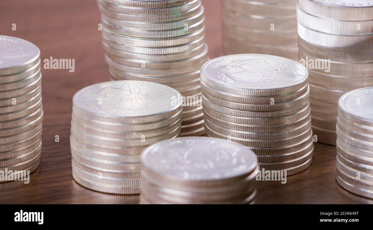 Stacks of silver coins hi-res stock photography and images - Alamy